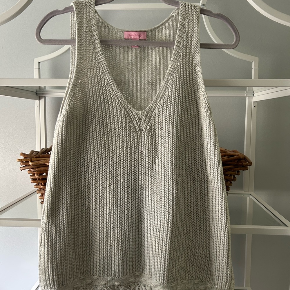Such a fun little sweater for summer! The pom-poms just make it perfect